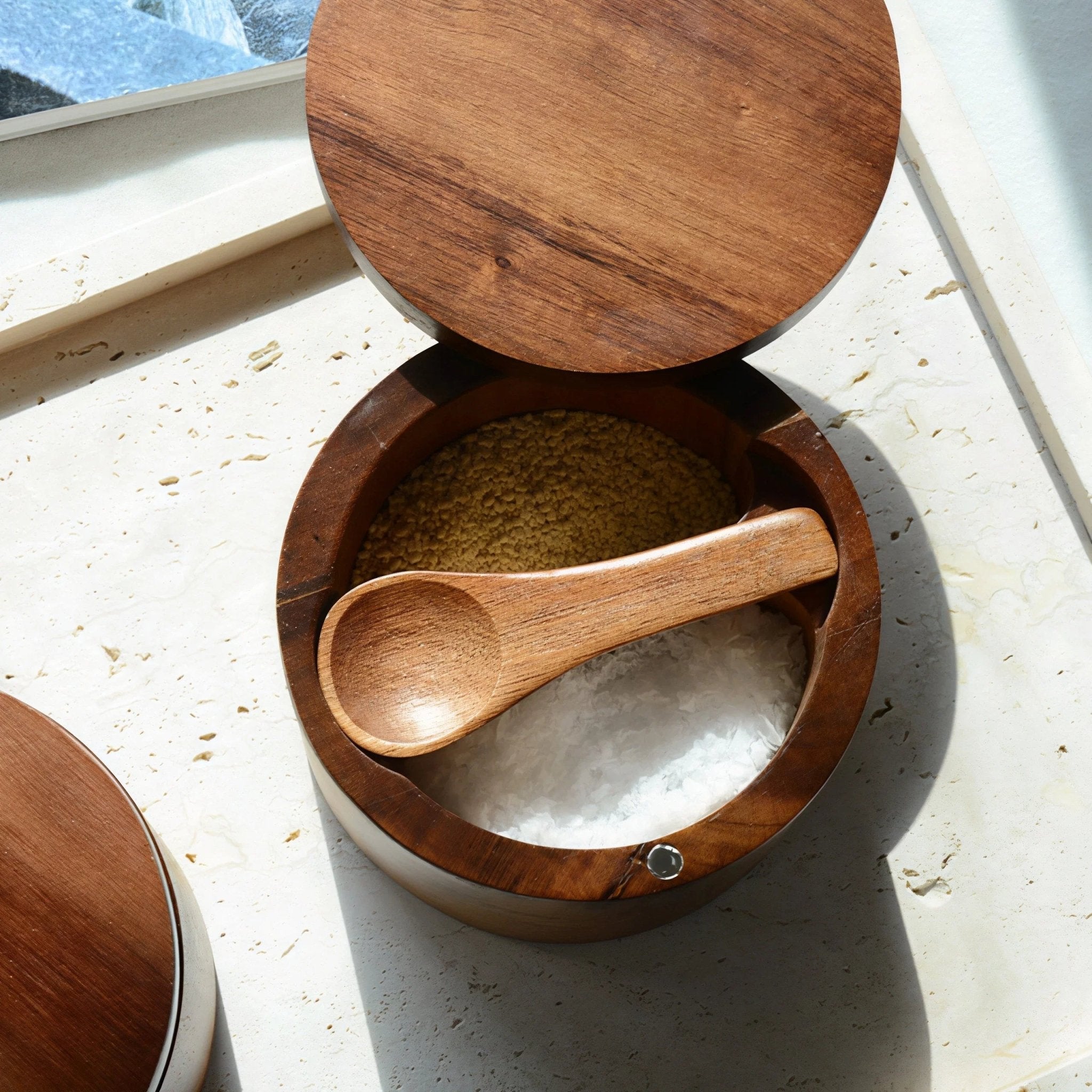 Oakory acacia wood salt and pepper cellars used for cooking ingredients on kitchen counter