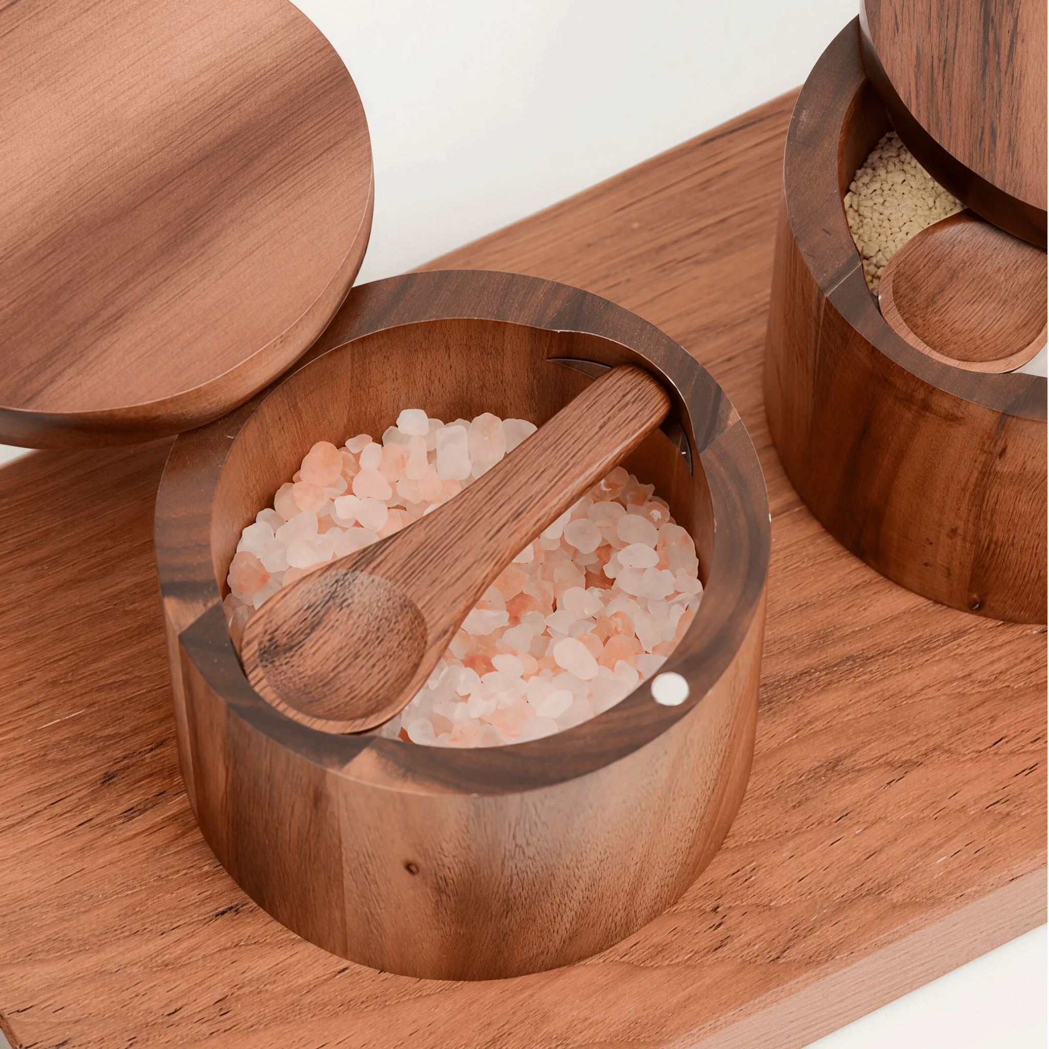 Oakory elegant acacia wood salt cellar styled on wooden board with salt and spices
