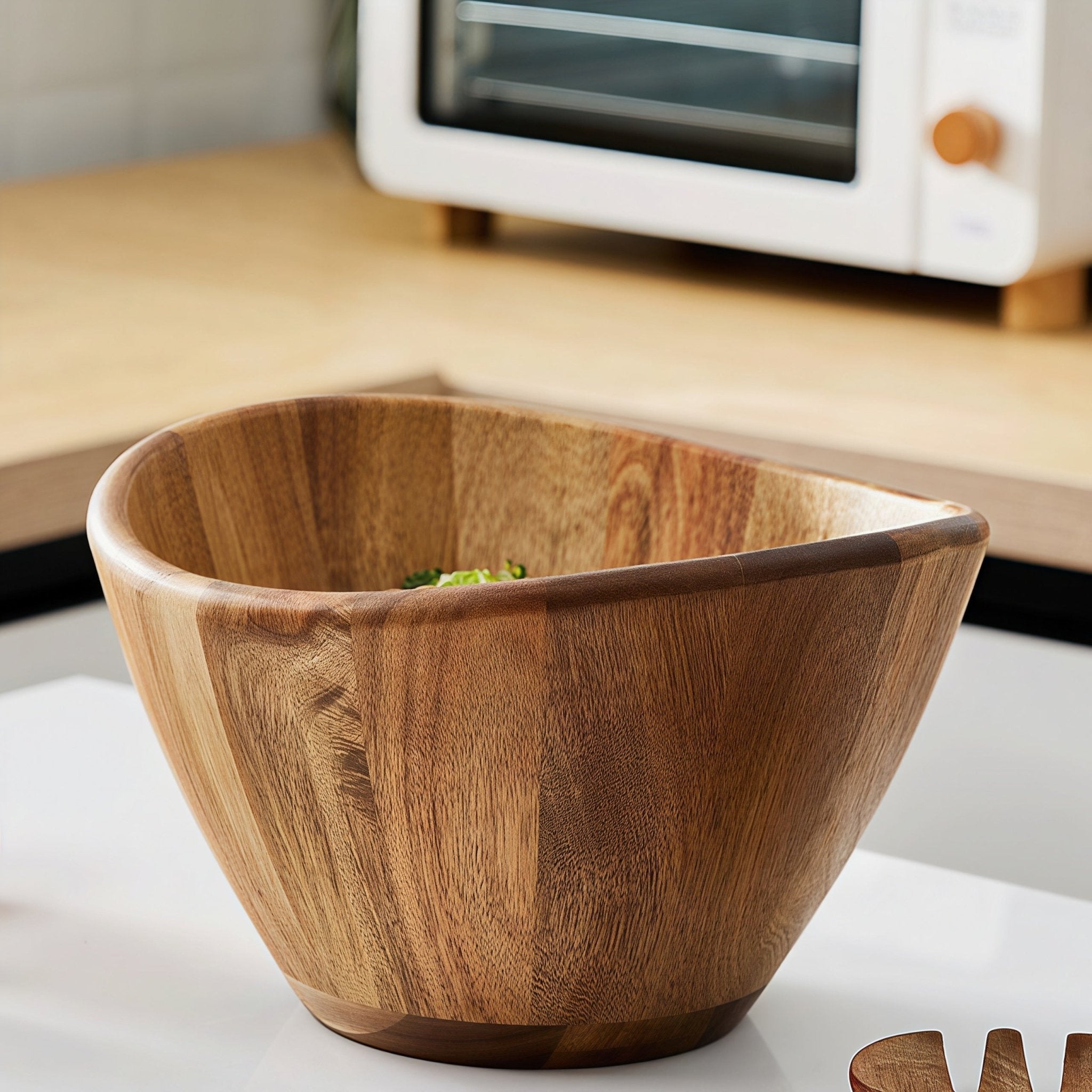Oakory acacia wave salad bowl displayed on kitchen counter with microwave background