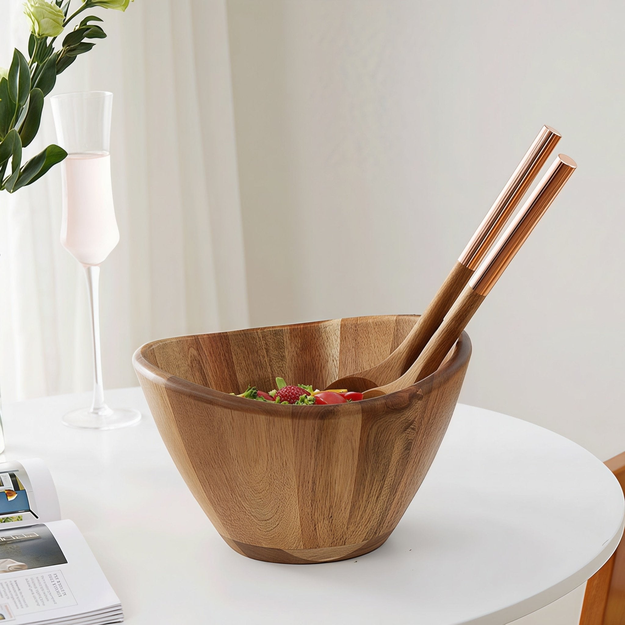 Oakory acacia wave salad bowl styled on dining table with champagne glass and servers