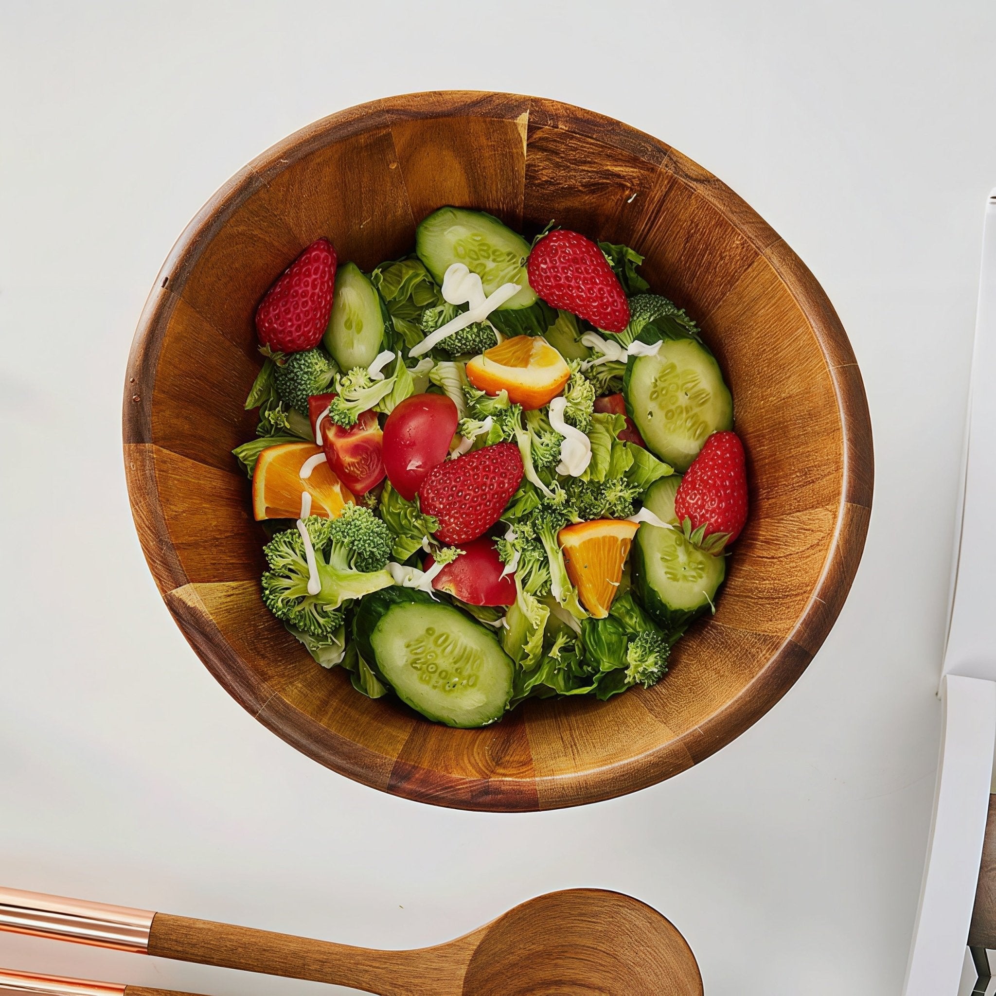 Top view of Oakory acacia wave salad bowl filled with fresh fruit and vegetable salad