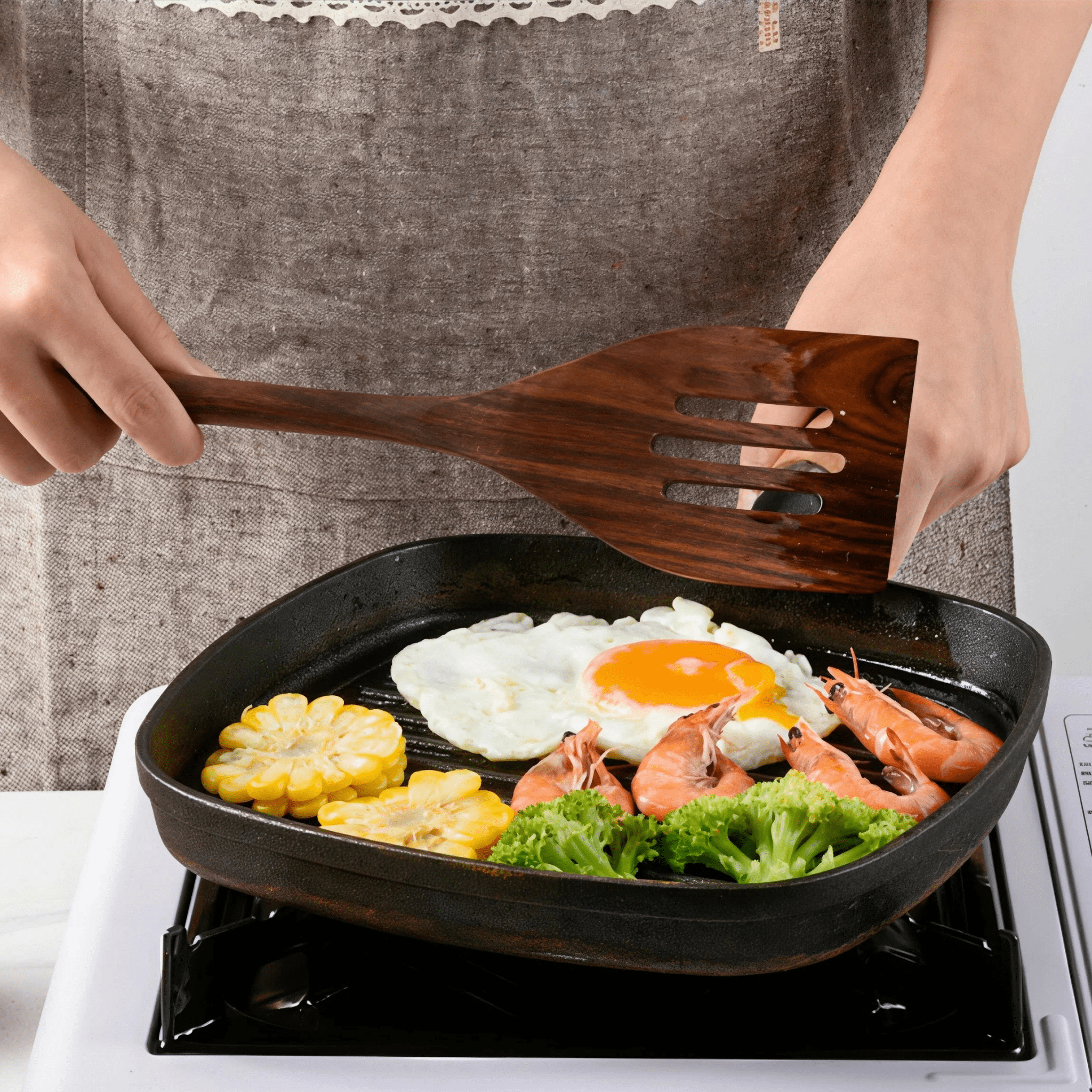 Oakory black walnut wooden spatula used for cooking eggs and seafood on non-stick pan