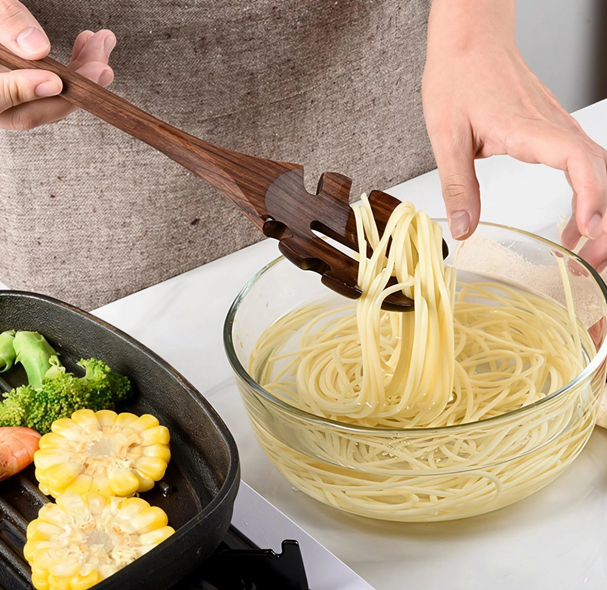 Oakory black walnut wooden pasta server used for lifting spaghetti from cooking pot