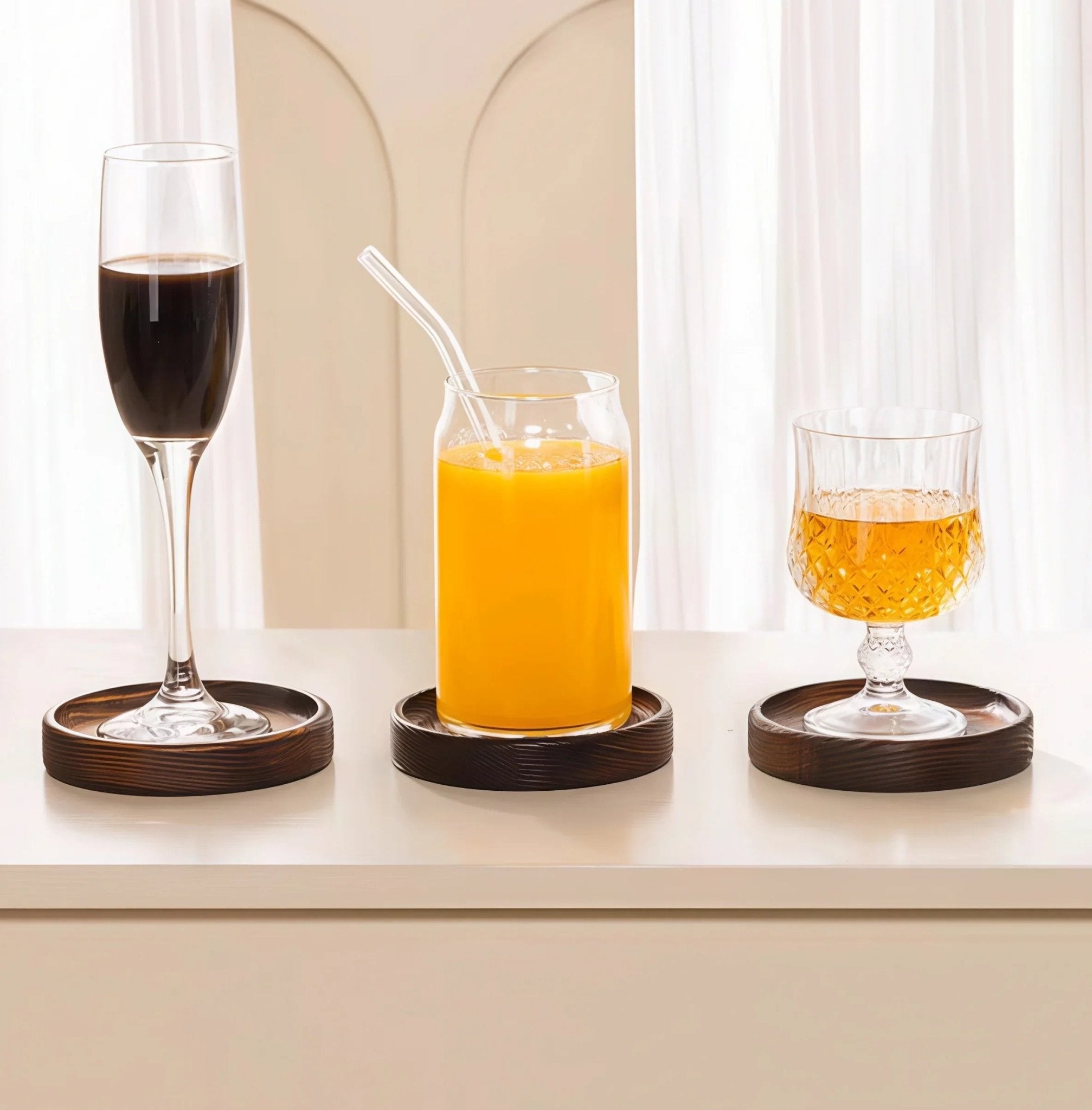 Oakory solid wood drink coasters used for wine, juice, and whiskey glasses on countertop