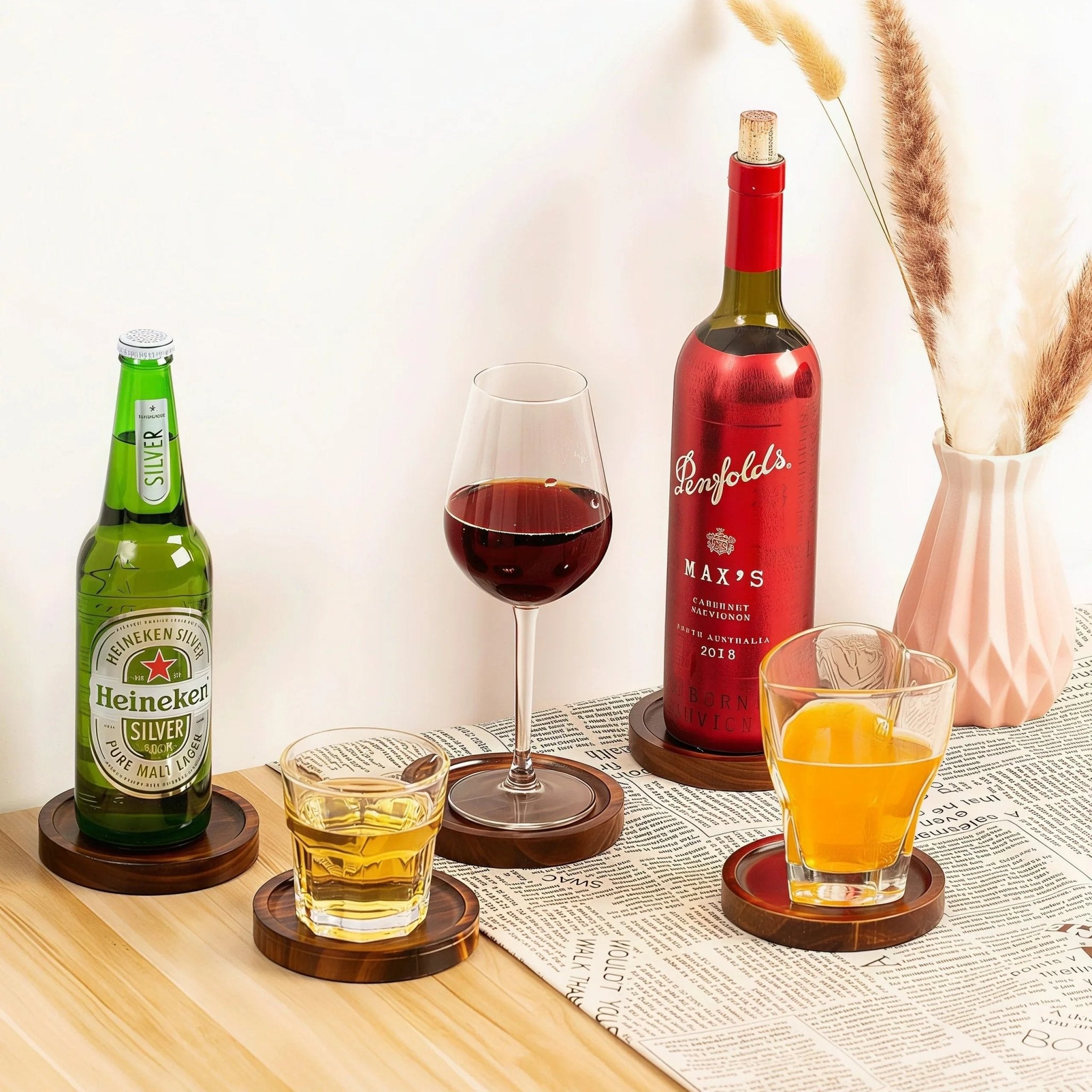 Oakory solid wood drink coasters styled with wine, beer, and cocktail glasses for entertaining