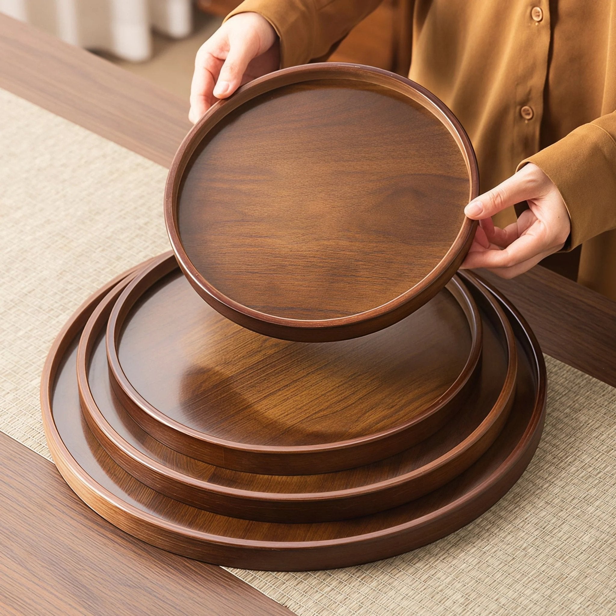 Oakory nesting solid wood round serving trays, demonstrating space-saving storage
