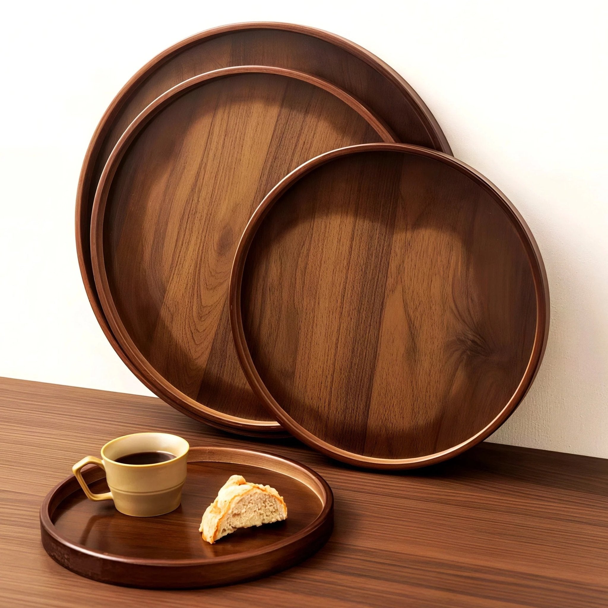 Oakory elegant solid wood round serving trays displayed on wooden table with coffee cup