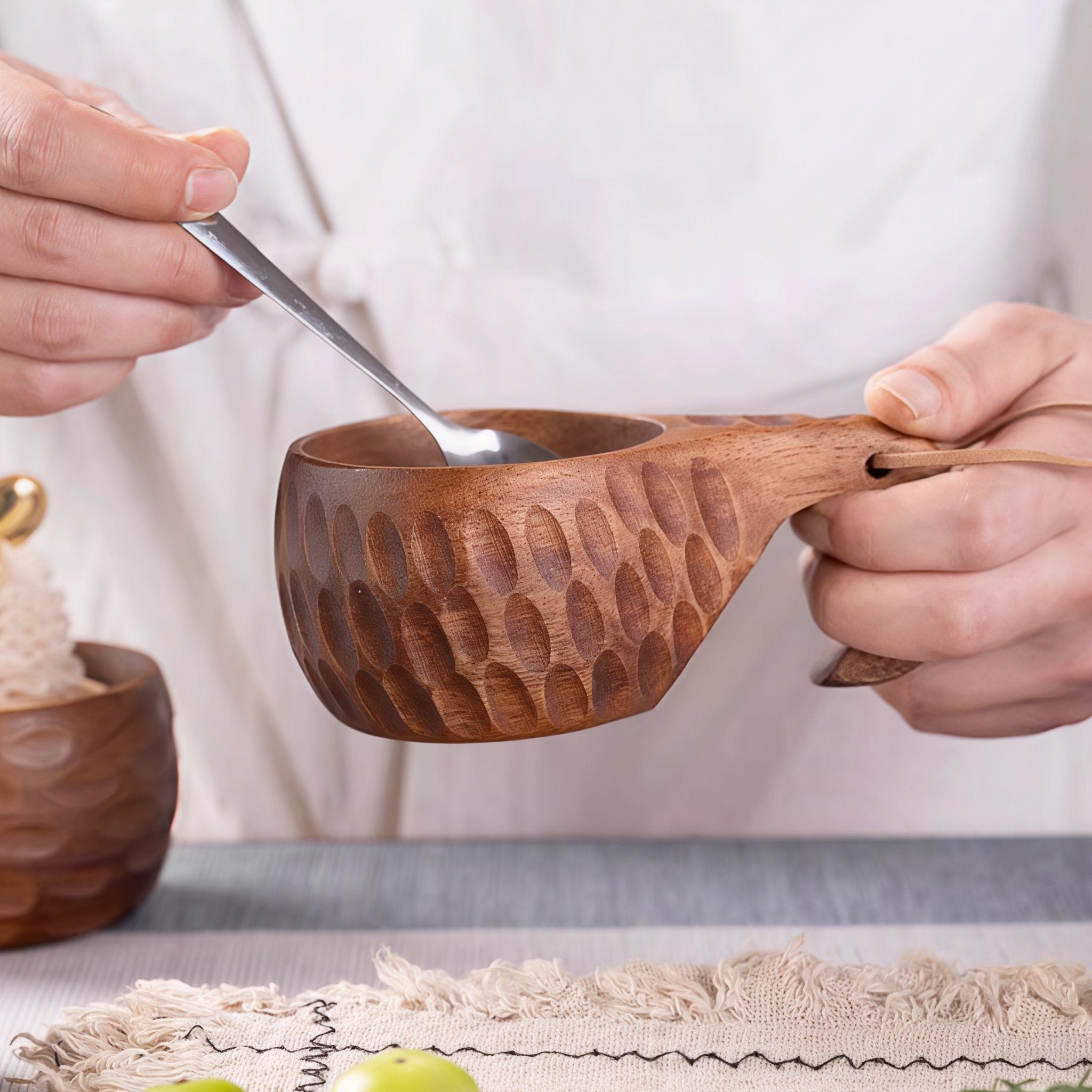 Oakory handcrafted wooden mug held for eating soup or dessert, textured hammered finish