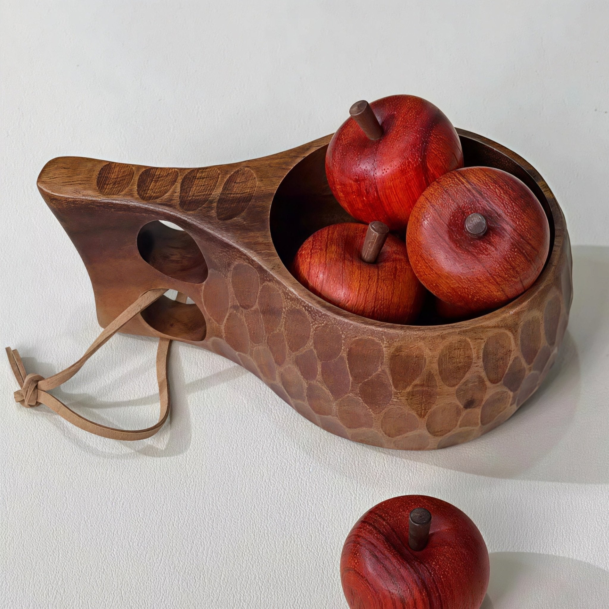 Oakory hammered wooden mug used for serving fresh apples, decorative tabletop display